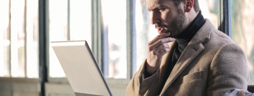 man questioning computer