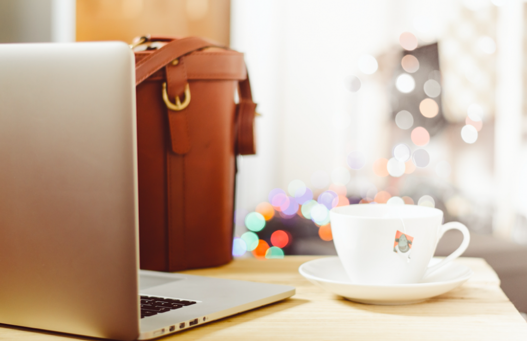 laptop with case and teacup