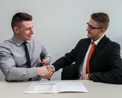 two men shaking hands