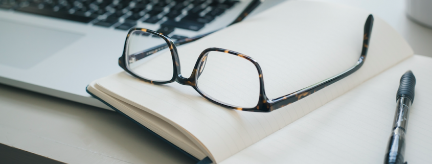 glasses on notebook