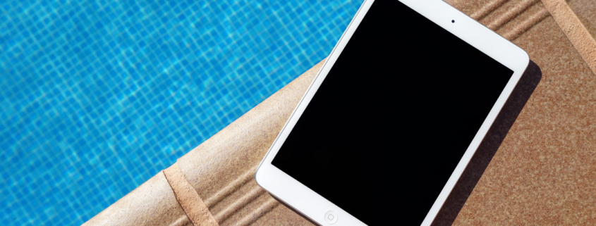 july newsletter tablet by pool