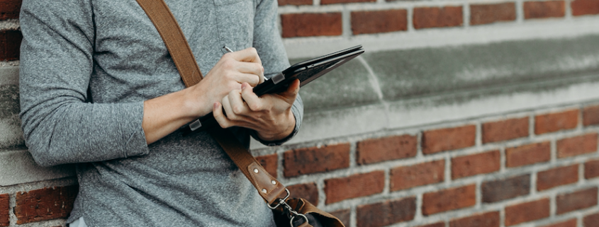 man reading on a tablet